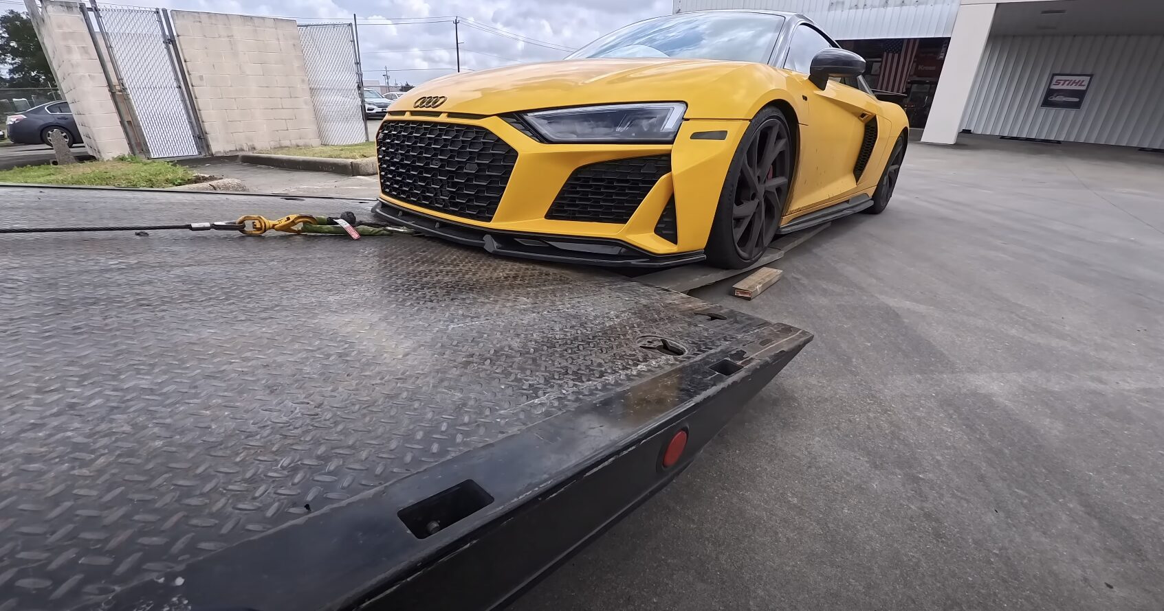 Professional flatbed towing service with luxury vehicle safely loaded in Maywood, CA Professional flatbed towing service with luxury vehicle safely loaded in Maywood, CA